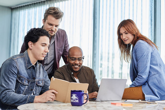 MGM employees engaged in creative meeting