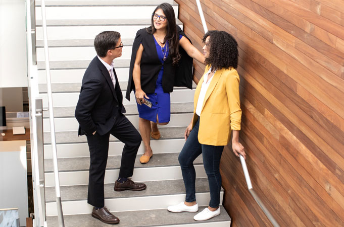 MGM Employees talking on stairs